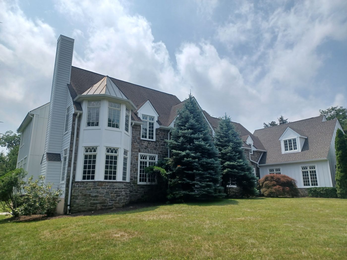 Addimando residence after stucco remediation and siding