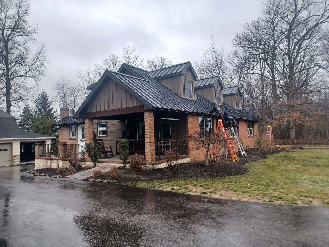 Mountain View Exteriors crew installing a standing seam metal roof on a Pennsylvania home